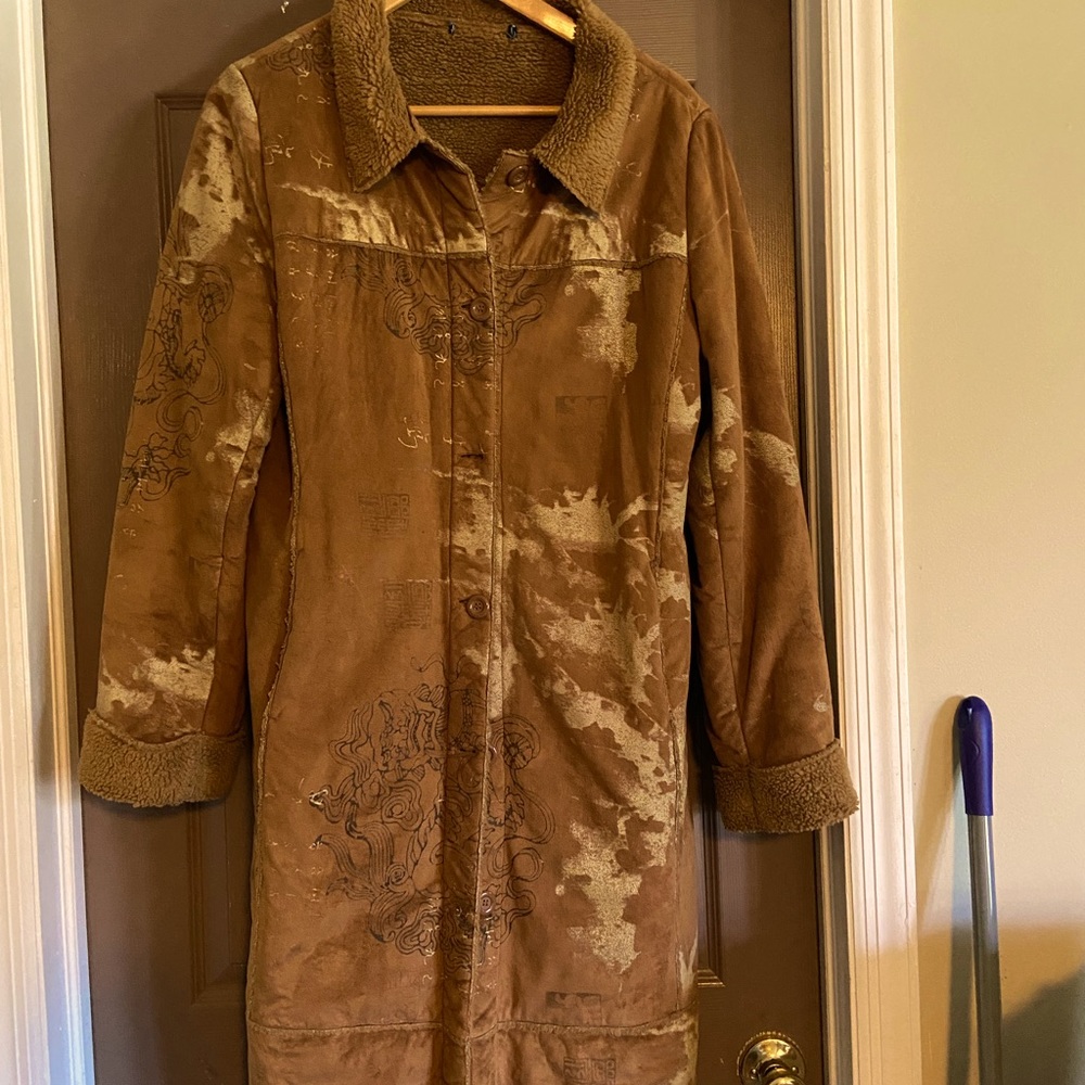 Unique Shearling look long coat.
